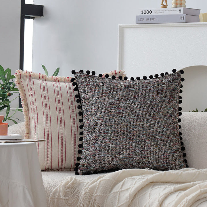 Square cushion cover with pompom trim and mottled boucle structure Bowlift