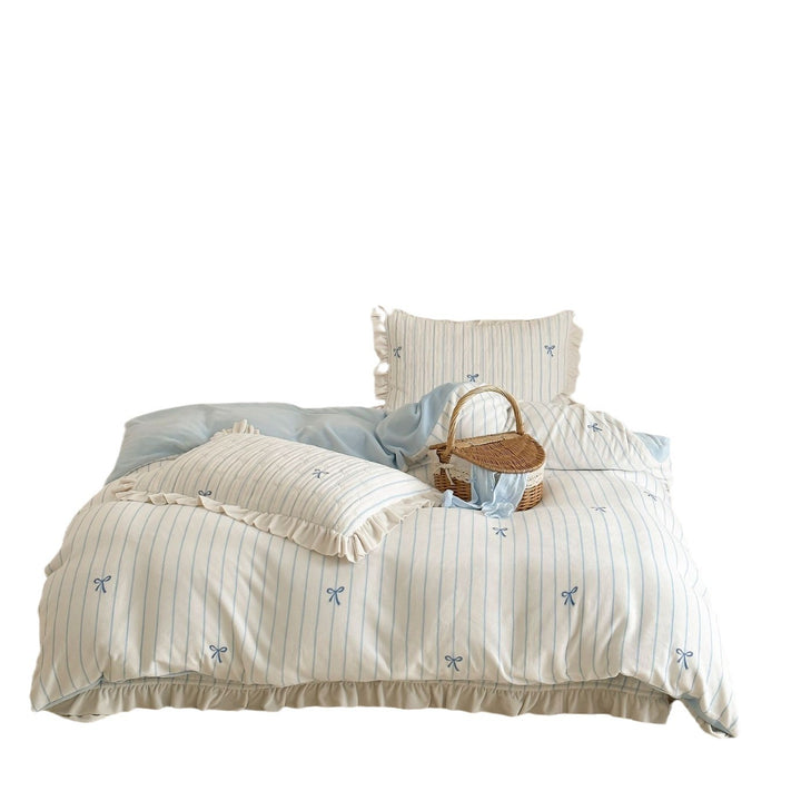 Padded bedding set with embroidered bows and frill