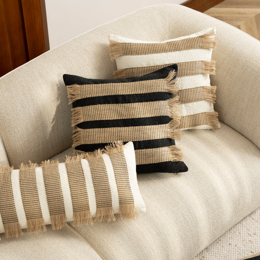Woven cushion cover with bouclé surface and jute fringes Bowlift