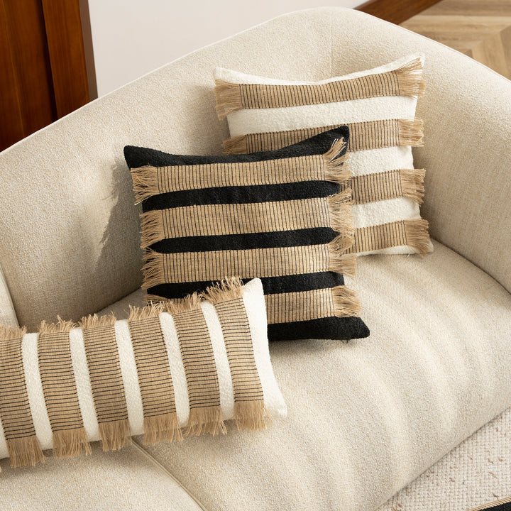 Woven cushion cover with bouclé surface and jute fringes Bowlift