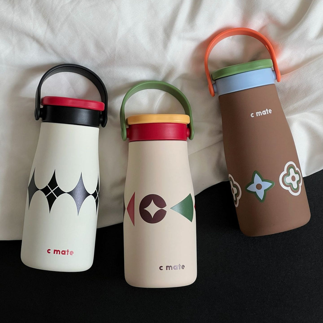 Women's ergonomic water bottle with practical carrying handle Bowlift