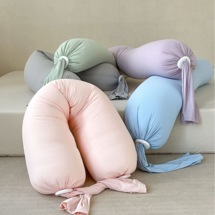 Ergonomic neck support pillow with soft stretch cover and adjustable knot ends