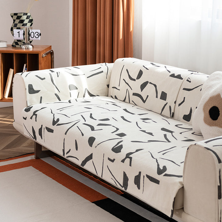 Stretch sofa cover with abstract brushstroke print and elastic waistband Bowlift