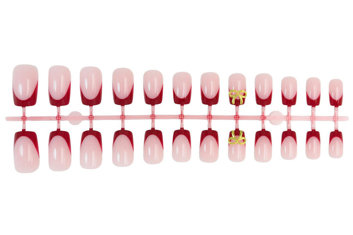 Artificial nail set with elegant red tips and refined bow decorations Bowlift