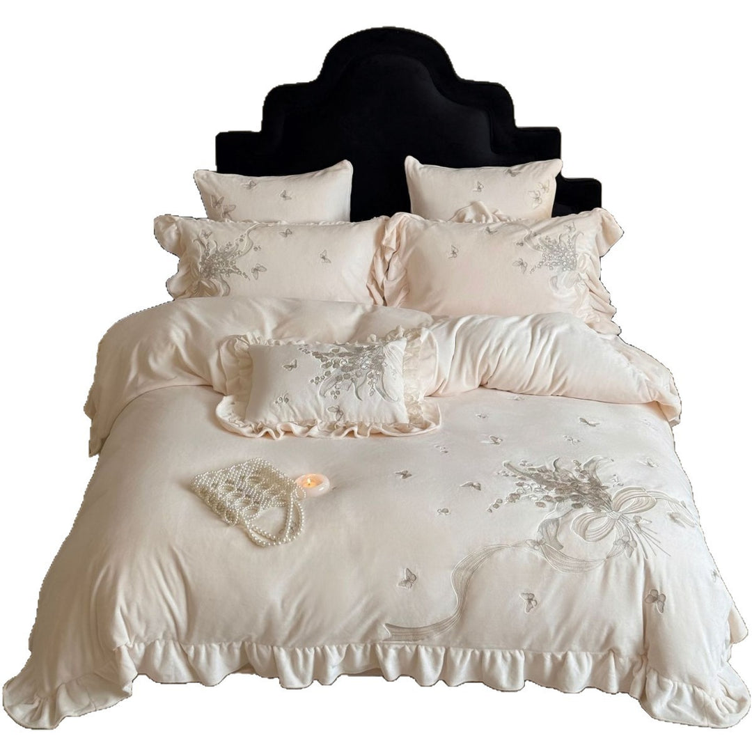 Luxurious bedding set with ruffles and floral embroidery