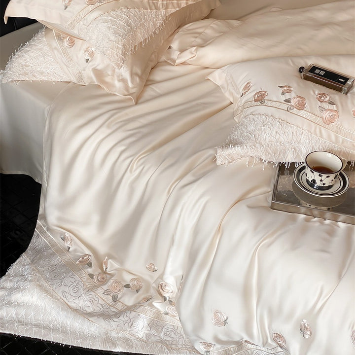 Luxurious satin bedding set with rose embroidery and fringed trim