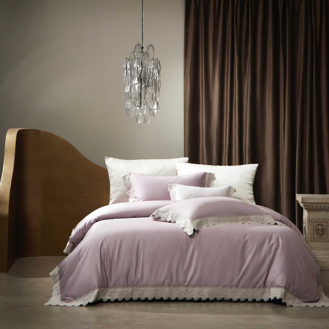 Romantic satin bedding set with delicate lace border and decorative pillowcases