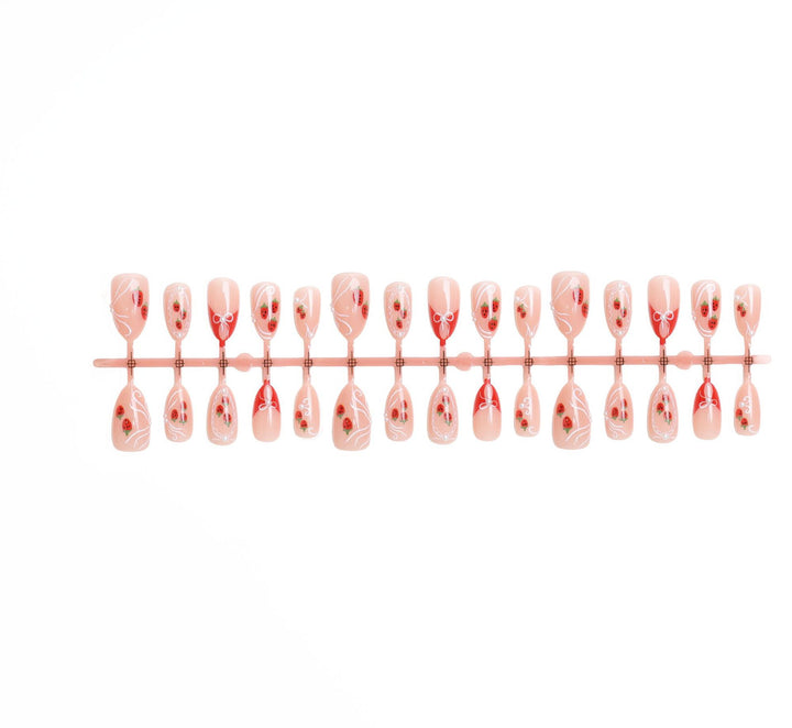 Artificial nail set with romantic strawberry and bow motifs Bowlift