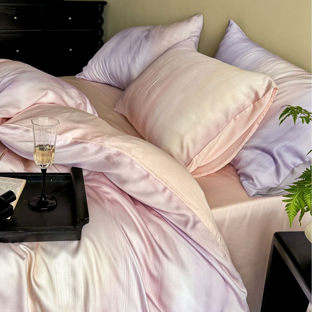 Luxurious Mako satin bedding set with gentle watercolor gradient and concealed hotel closure