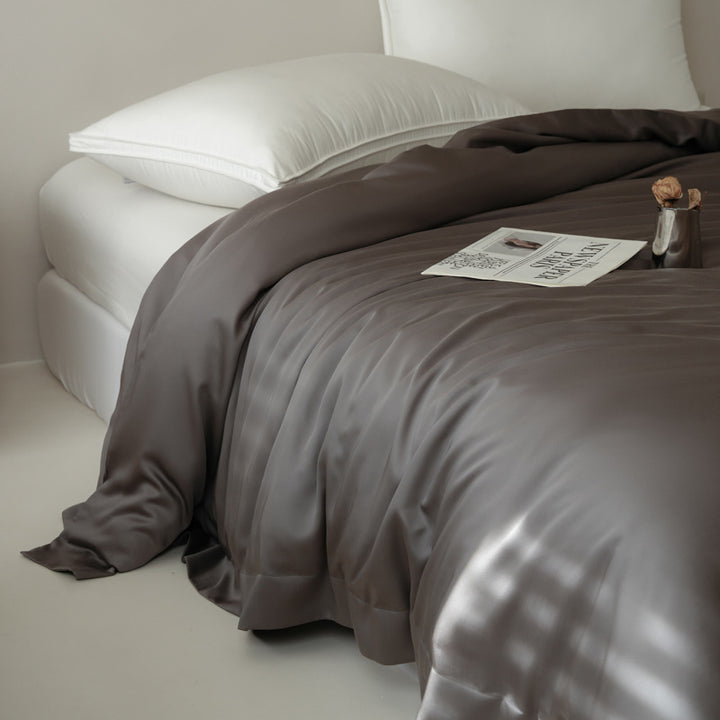 Silky satin bedspread with draping fall and easy-care finish