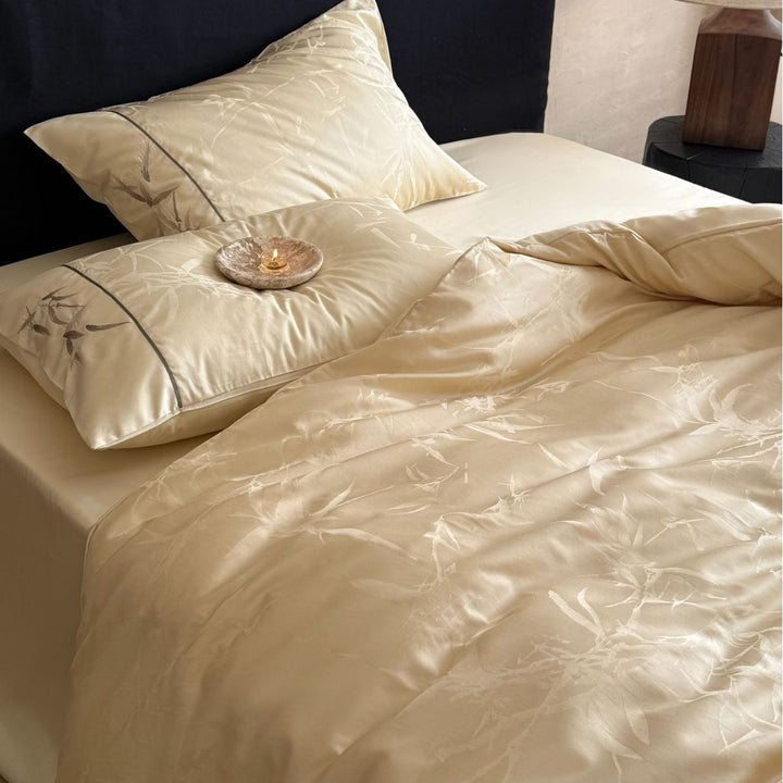 Premium Satin bedding set with subtle jacquard leaf pattern and silky finish