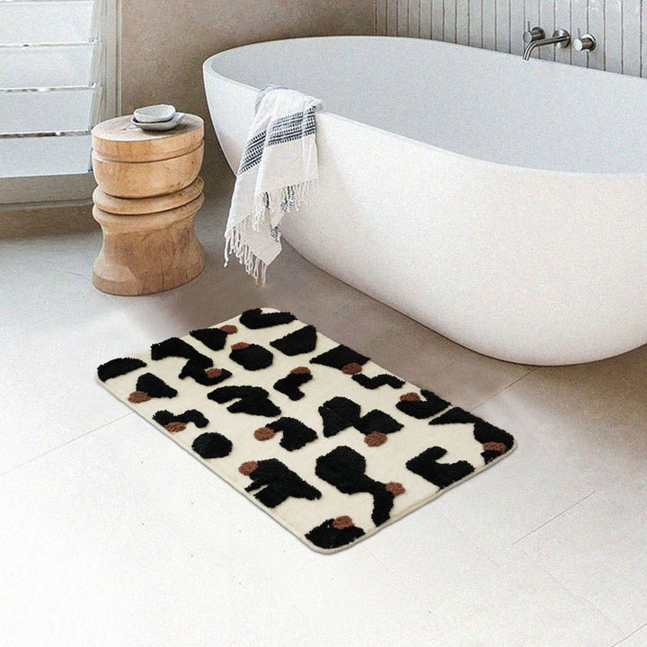 Tufted bathroom mat in abstract leopard pattern with soft high pile Bowlift