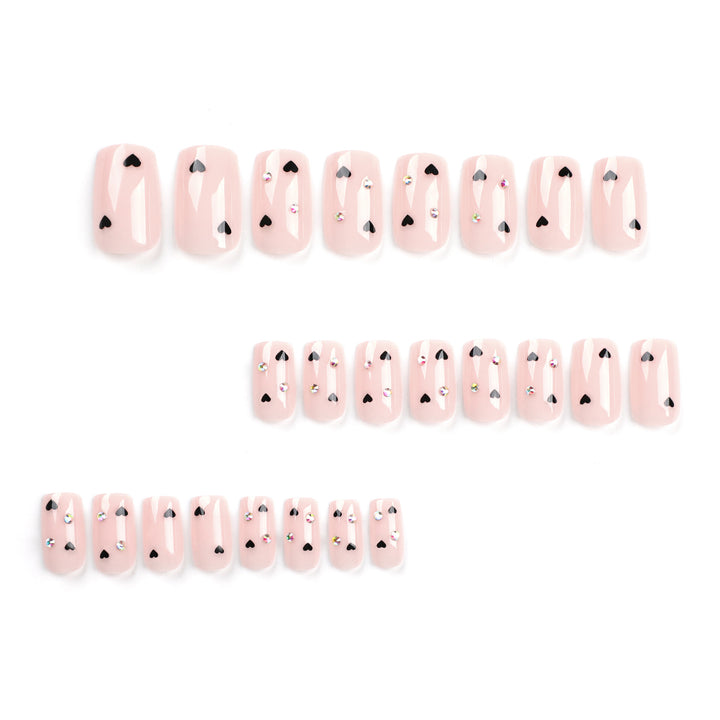 Artistic nail art with heart design and glitter accents Bowlift