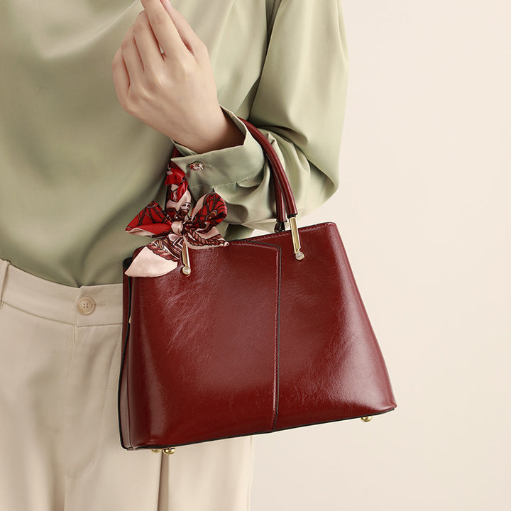 Stylish Structured Handbag with Decorative Scarf