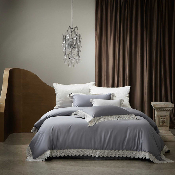 Romantic satin bedding set with delicate lace border and decorative pillowcases