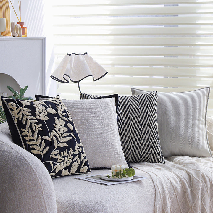 Square cushion cover with subtle herringbone texture and surrounding piping seam Bowlift