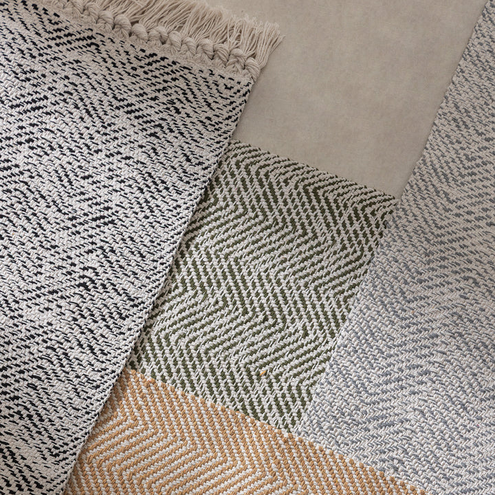 Braided runner rug with herringbone pattern and fringe edge Bowlift