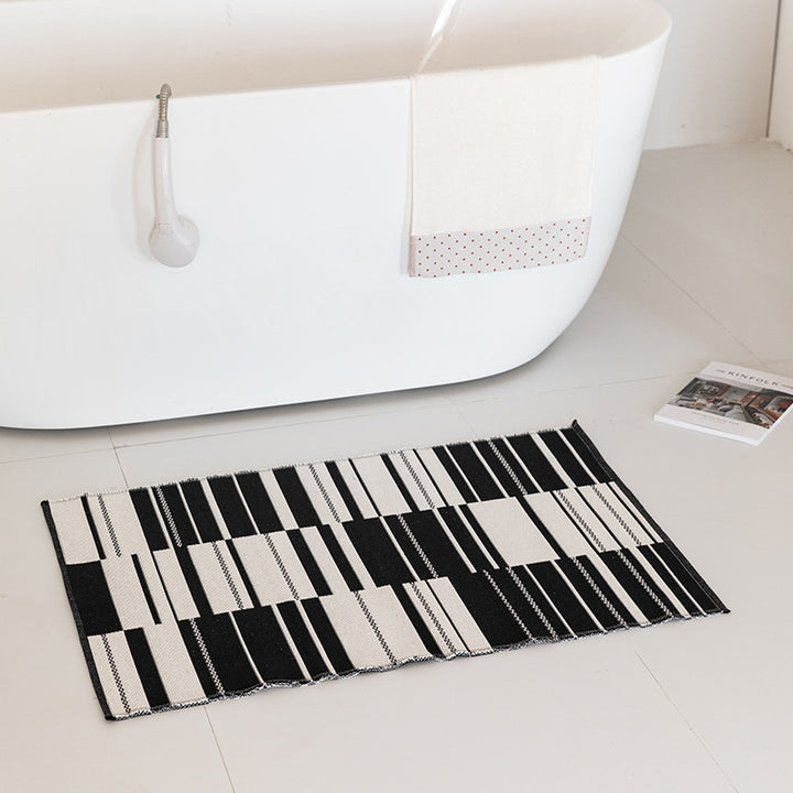 Flat-woven bath mat with abstract geometric pattern Bowlift