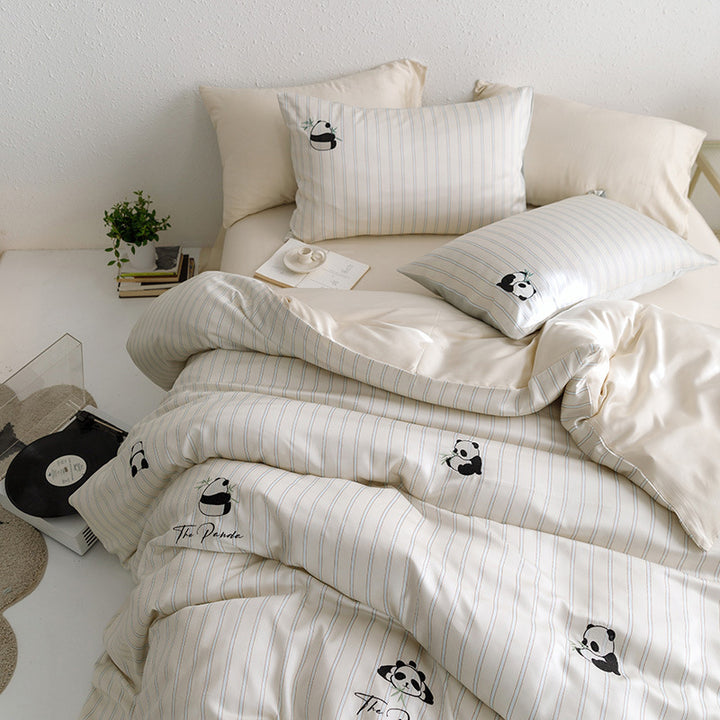 Quilted bed set with panda embroidery and fine stripe texture