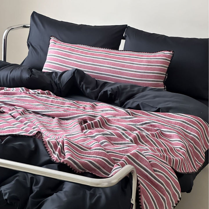 Striped sofa cushion and throw blanket set with decorative cord edge