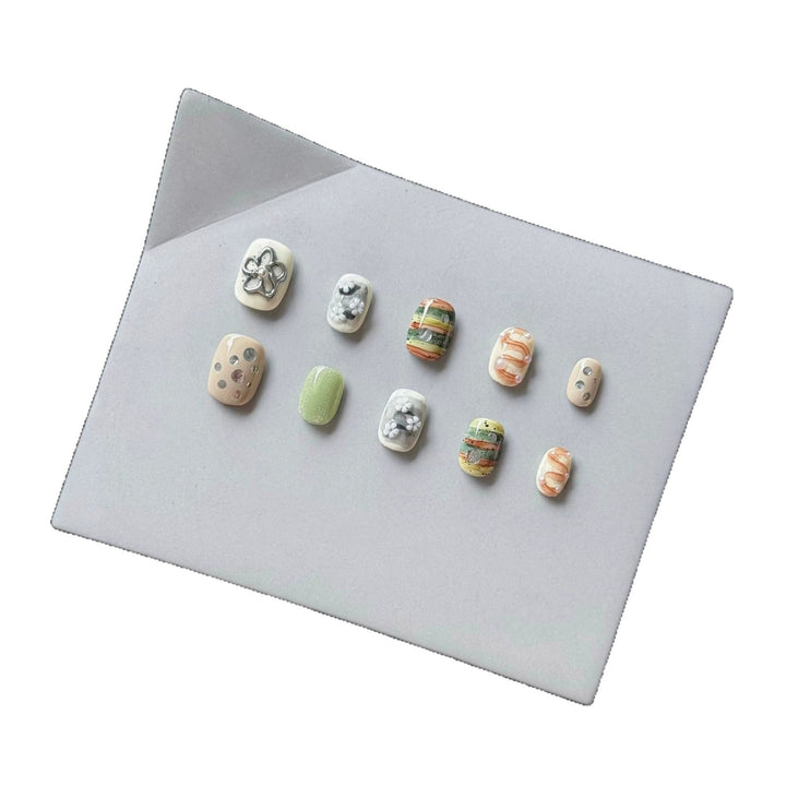 Artistic Press-On Nail Set with Floral and Textured Designs