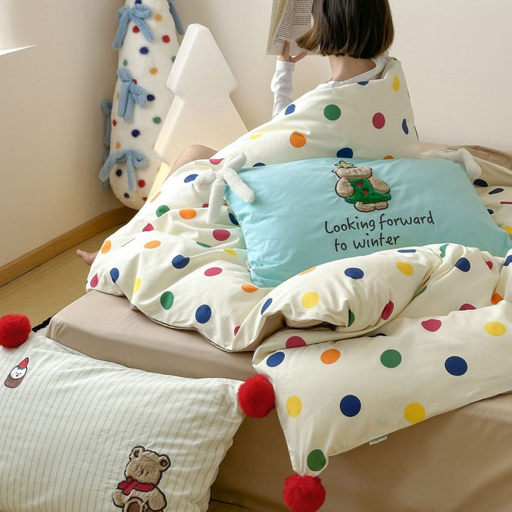 Playful cotton bedding set with pompom trim and embroidered rabbit motif