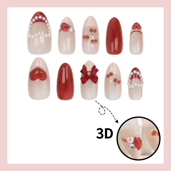 Artificial nail set with romantic berry designs and glamorous embellishments Bowlift