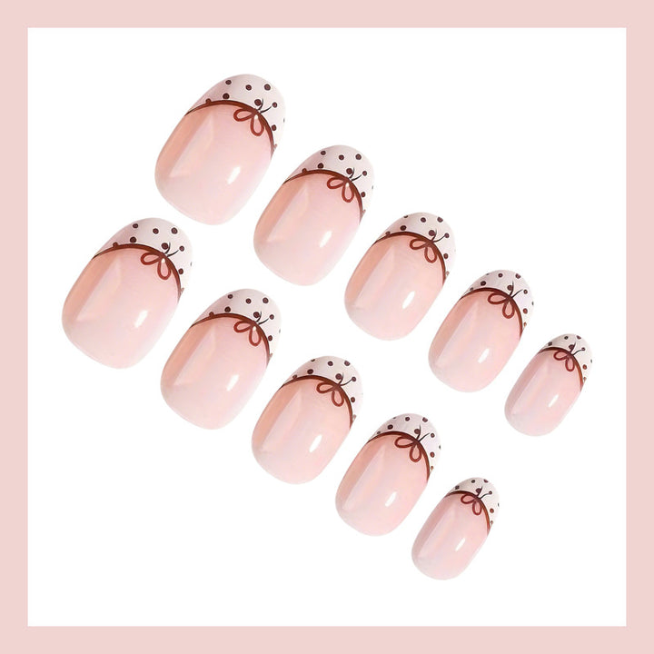 Artificial nail set with elegant bow and dot patterns Bowlift