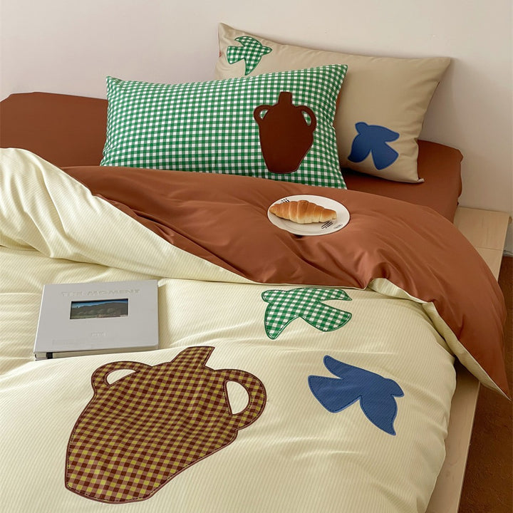 Duvet cover set with applied ceramic and check details, reversible function