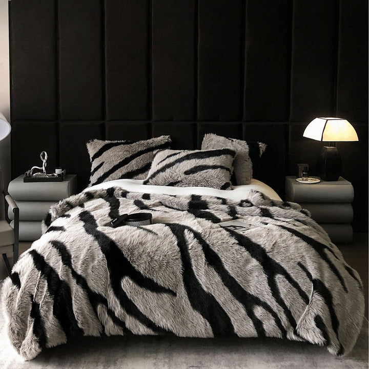 Faux fur bedspread with zebra pattern and decorative pillow set