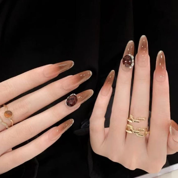 Elegant artificial nails with rhinestone applications Bowlift