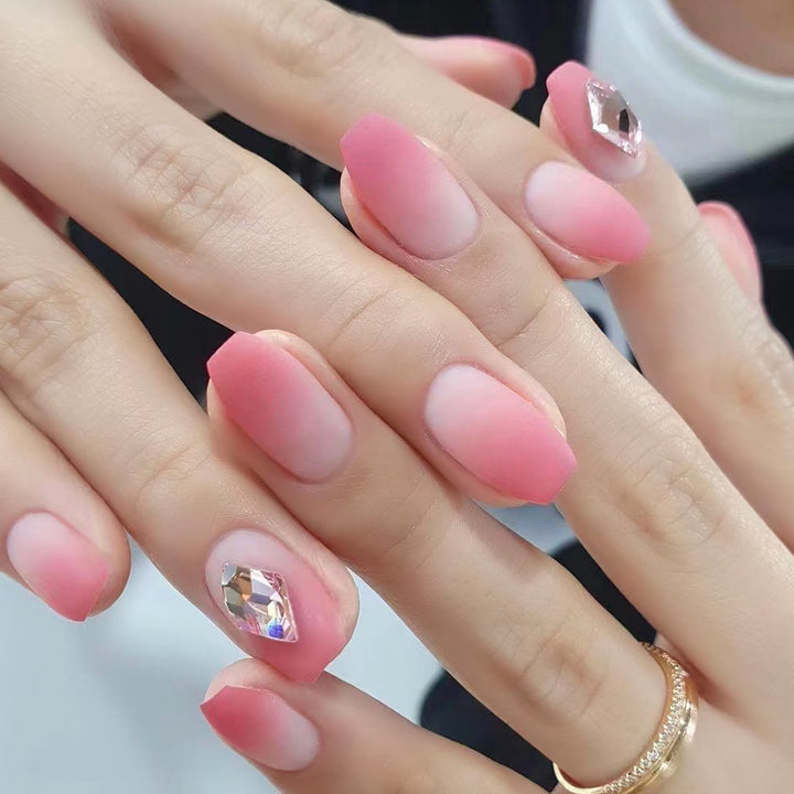 Glamorous nail art with elegant rhinestone accents Bowlift