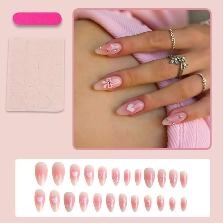 Artificial nail set with delicate bow embellishments Bowlift