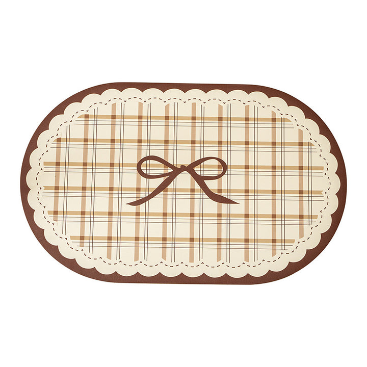 Rectangular wipeable placemat with checked pattern, wavy decorative edge and bow motif Bowlift