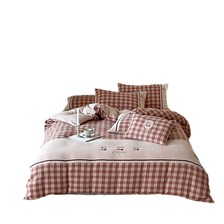 Luxurious cotton bedding set with check pattern and embroidered floral appliqués