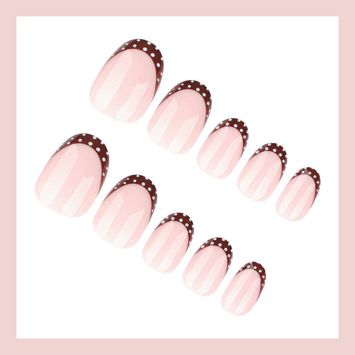 Artificial nail set with elegant French tips and subtle dots Bowlift