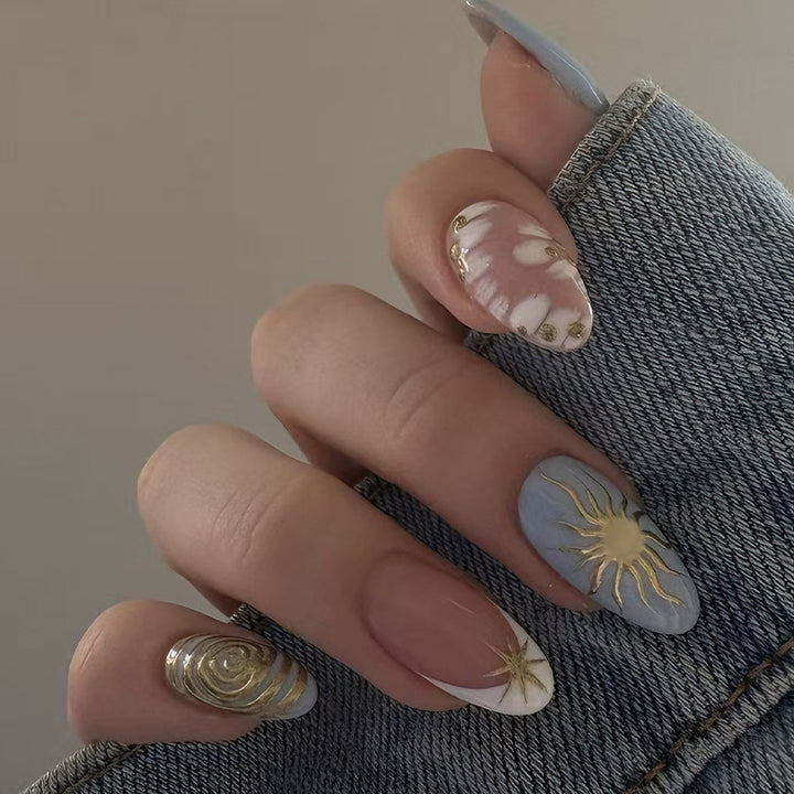Nail art set with elegant gold accents and creative design Bowlift