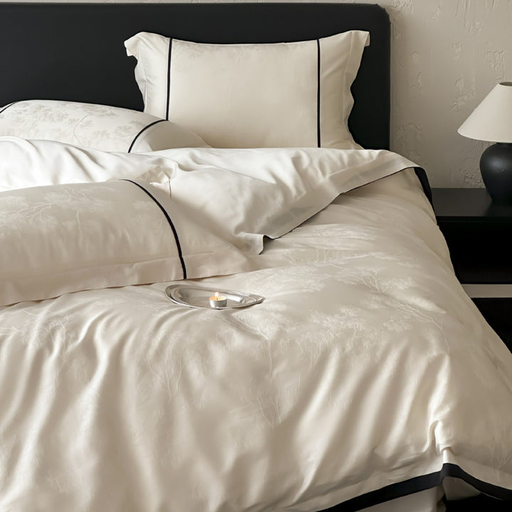 Luxurious jacquard bedding set with subtle tree relief and contrasting piping
