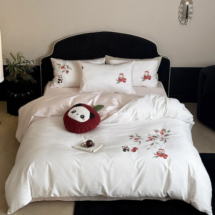 Bedding set with embroidered panda and flower motifs