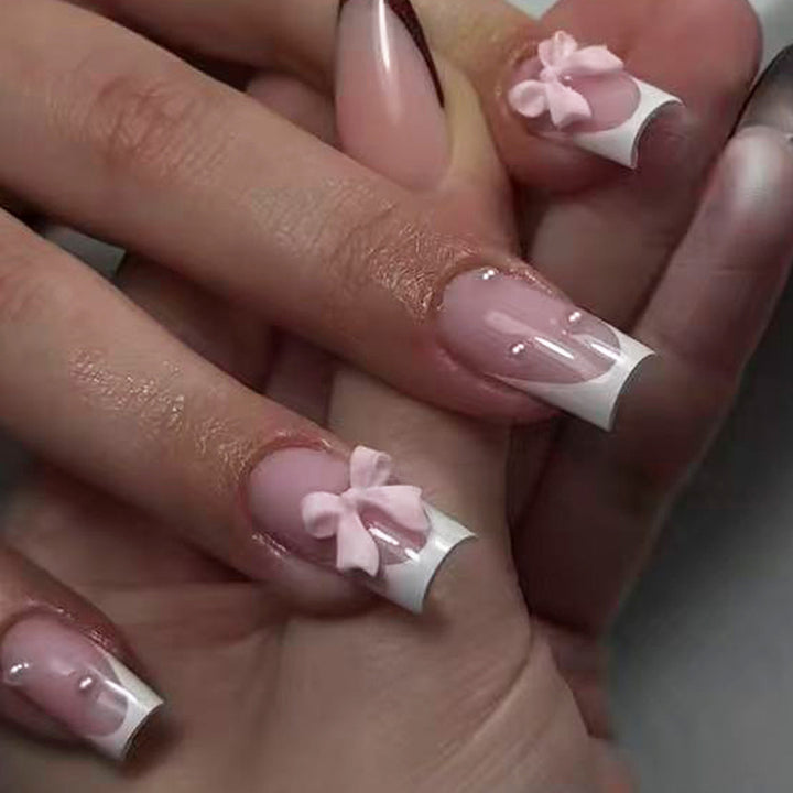 Nail art set with playful ribbon designs and elegant accents Bowlift