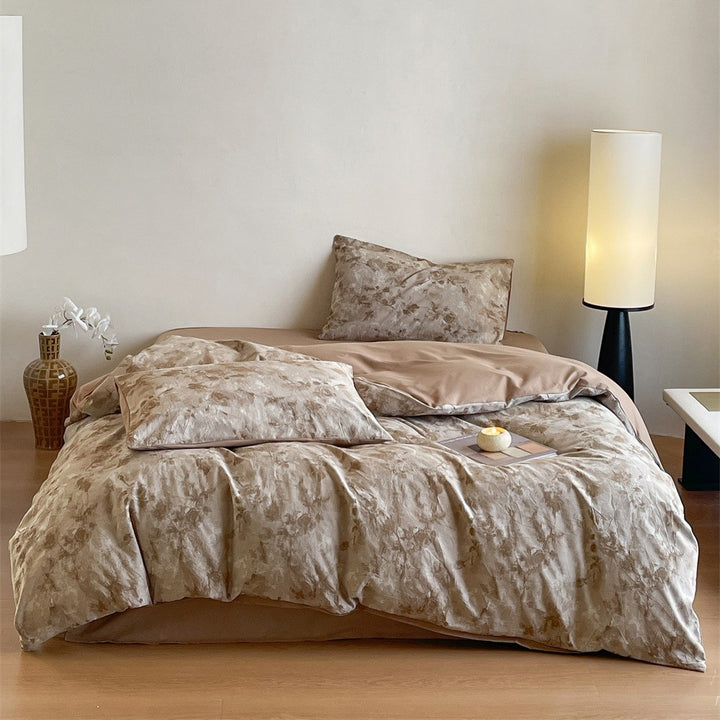 Bedding set made of washed cotton satin with a textured houndstooth pattern and reversible function