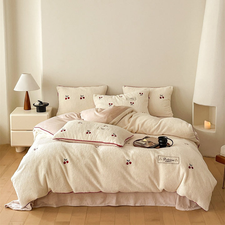 Cozy flannel bedding set with embroidered bows and reversible feature