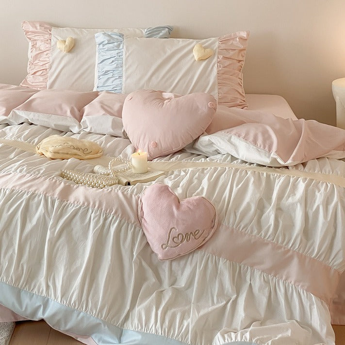 Bedding set with gathered pleat look, heart appliqués and ruffle