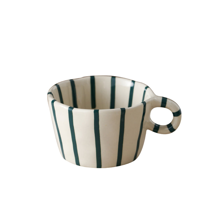 Handmade ceramic mug with ergonomic handle and wavy rim