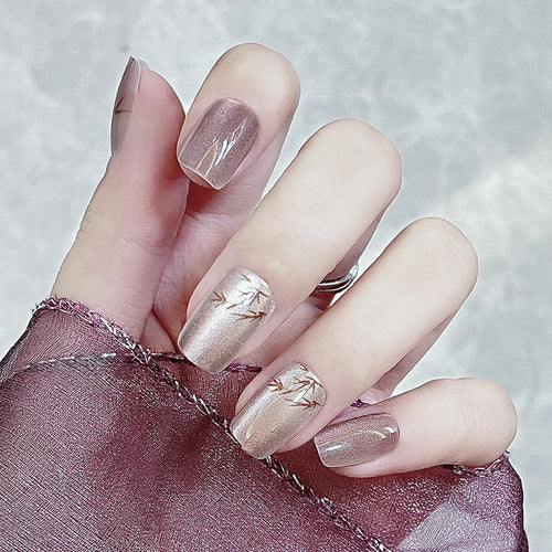 Artistic Press-On Nail Design with Elegant Accents Bowlift