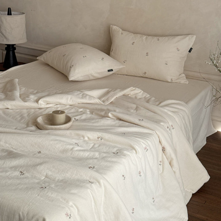 Linen bedding set with subtle floral embroidery