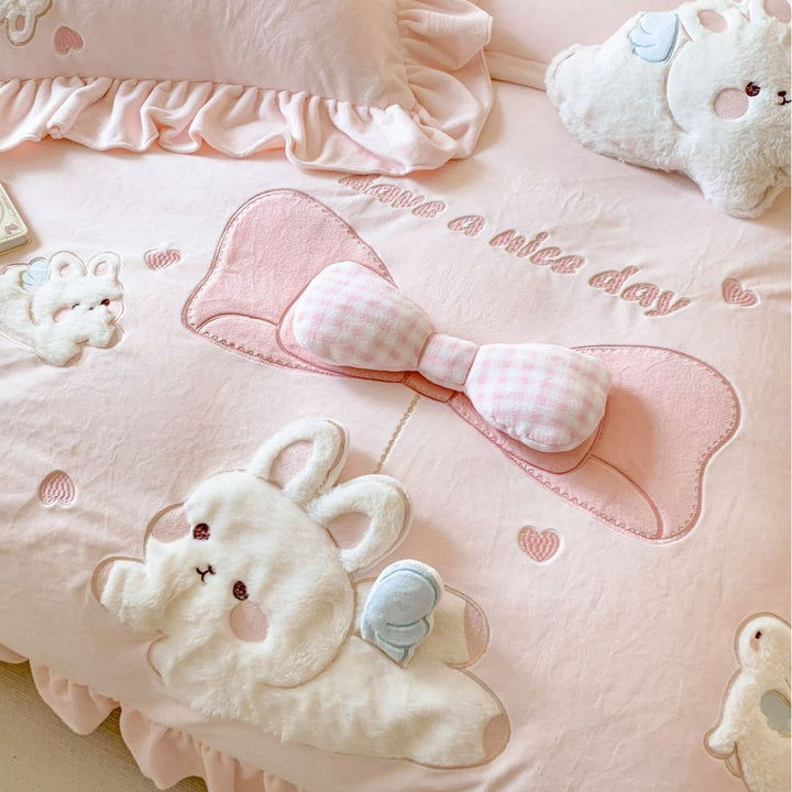 playful bedding set with frills and plush applications
