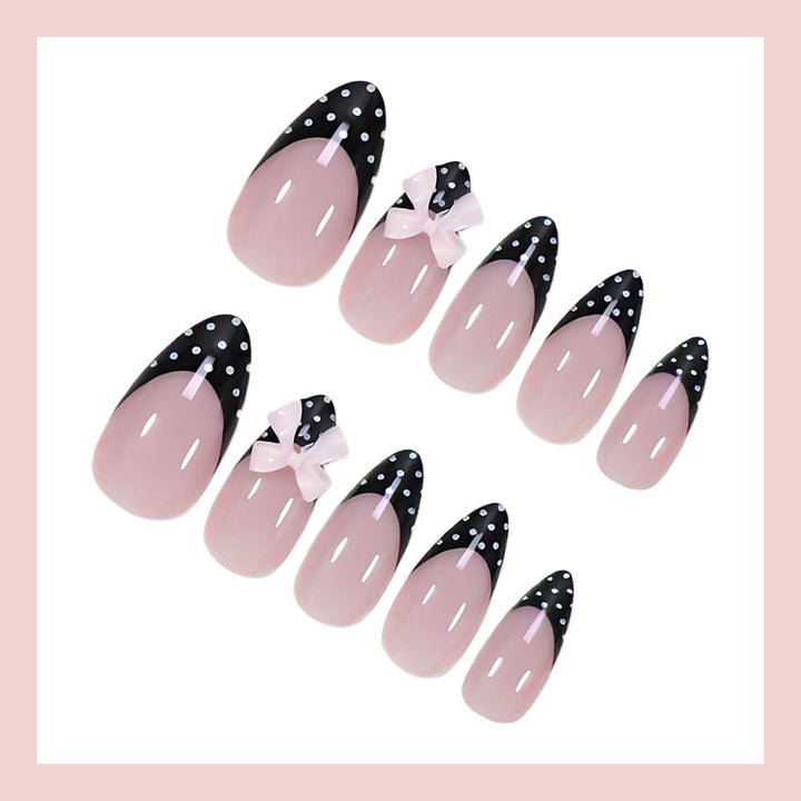 Artificial nail set with glamorous black and white polka dot accents Bowlift