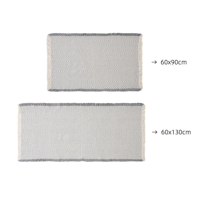 Handwoven cotton bath mat with herringbone pattern and fringes Bowlift