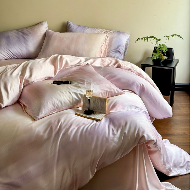 Luxurious Mako satin bedding set with gentle watercolor gradient and concealed hotel closure